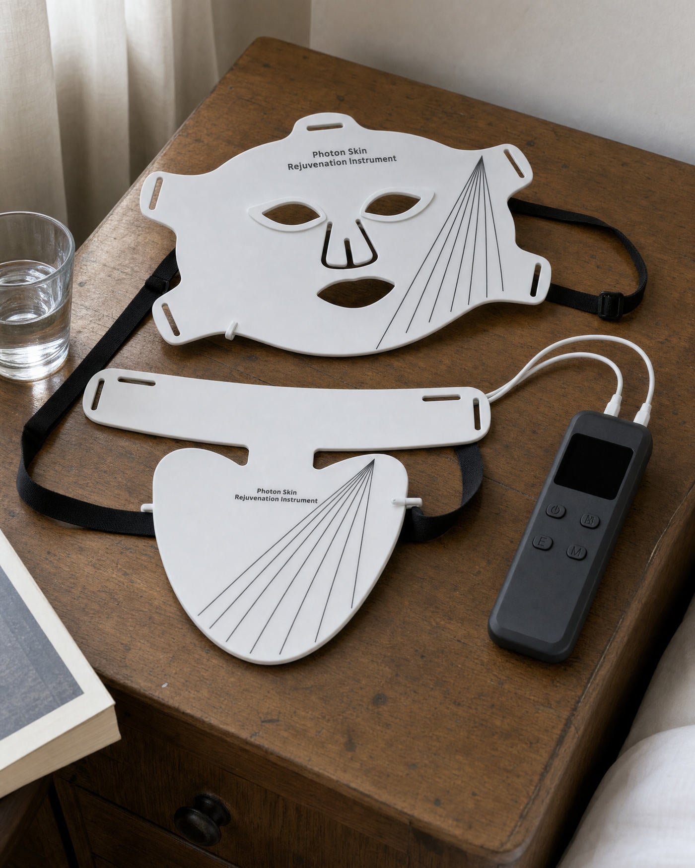 Both pieces and the controller put down on a bedside table
