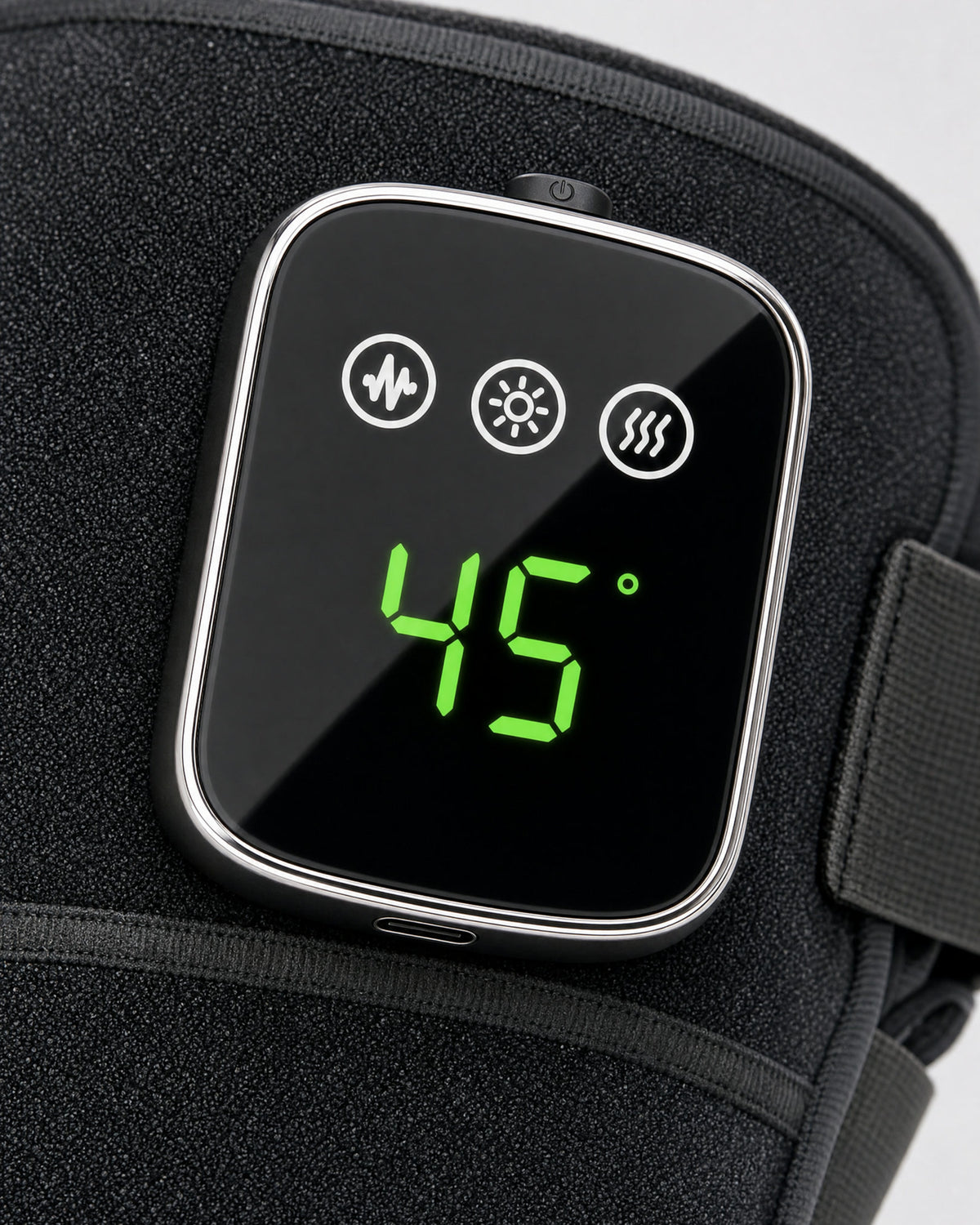 The touch pod: massage, light and heat keys above a green display