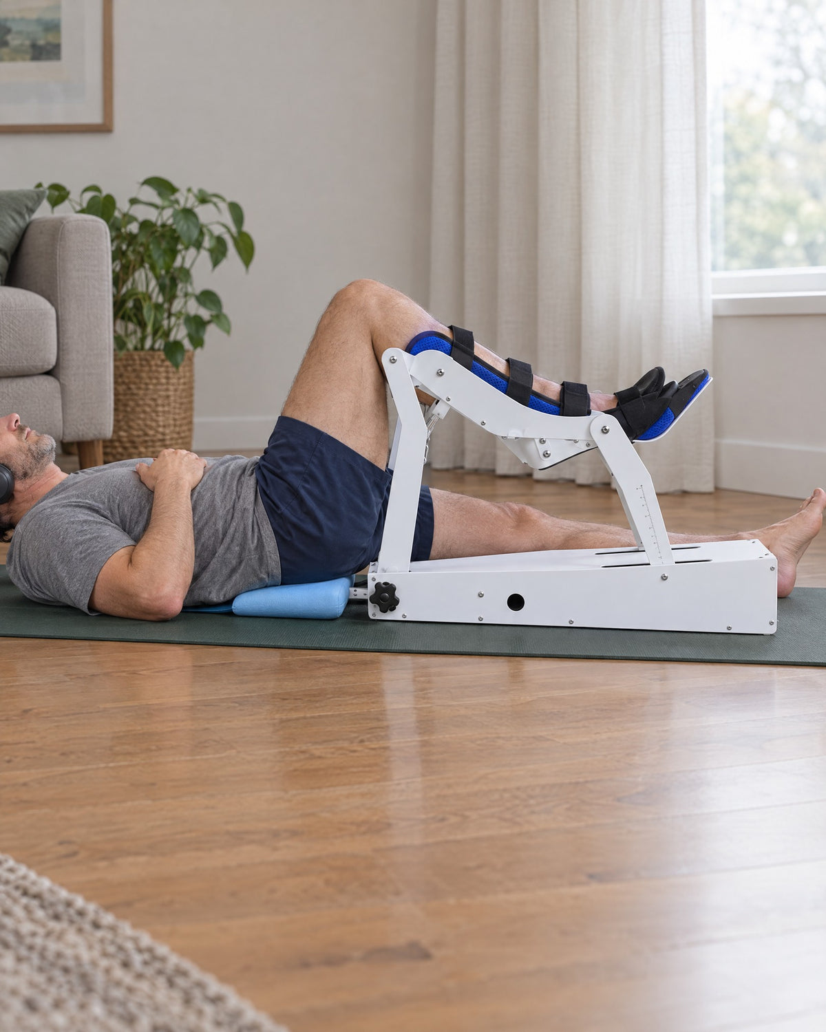 Lying back on a mat with one leg in Glide