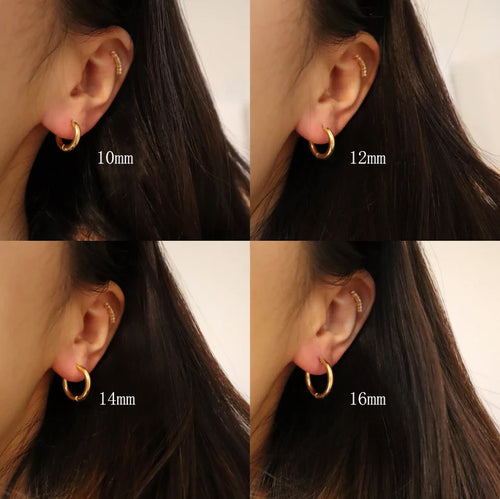 Cercle 18K huggie hoop earrings worn