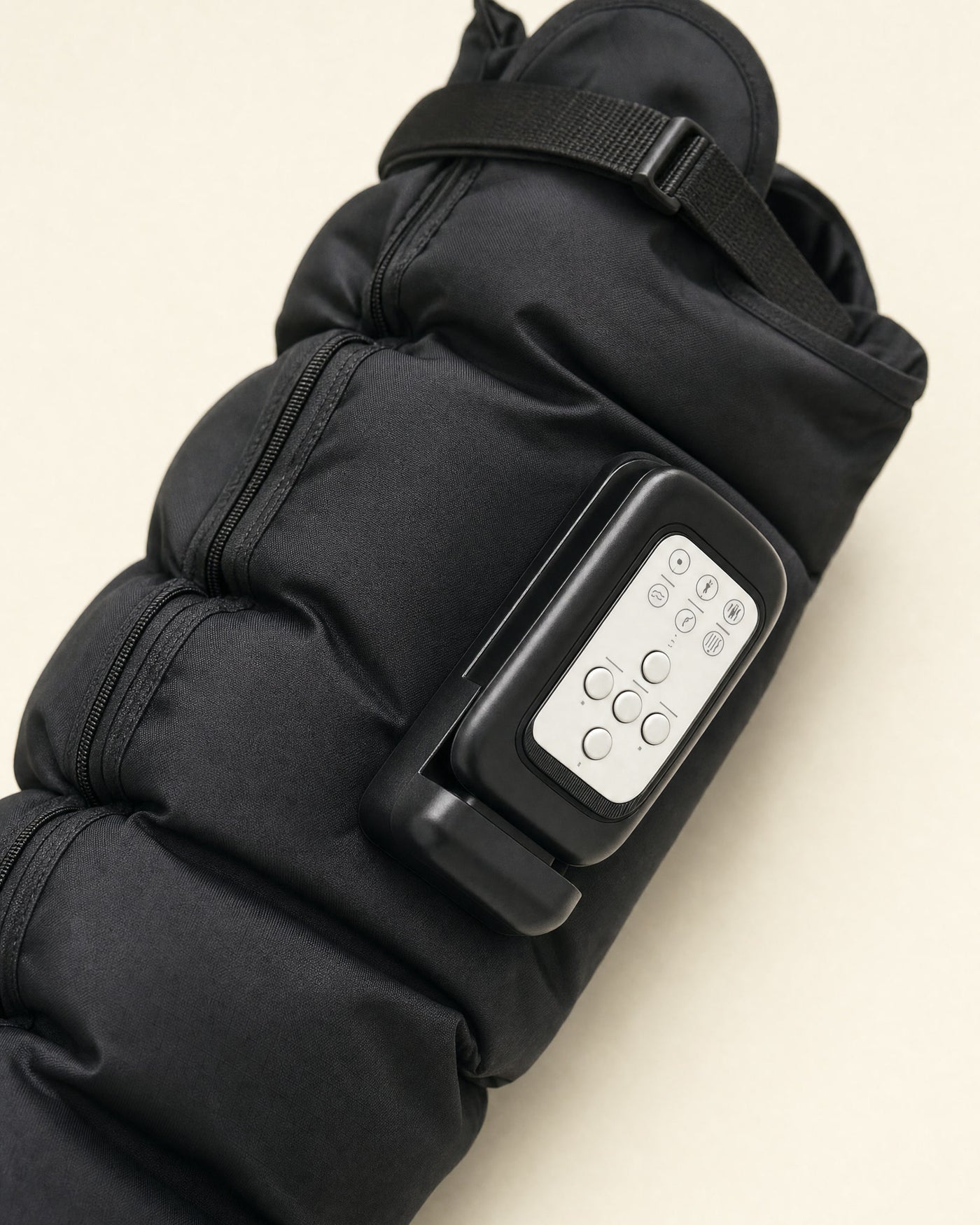 The Flow 2 control pod clipped flat onto the boot - six buttons, no hose