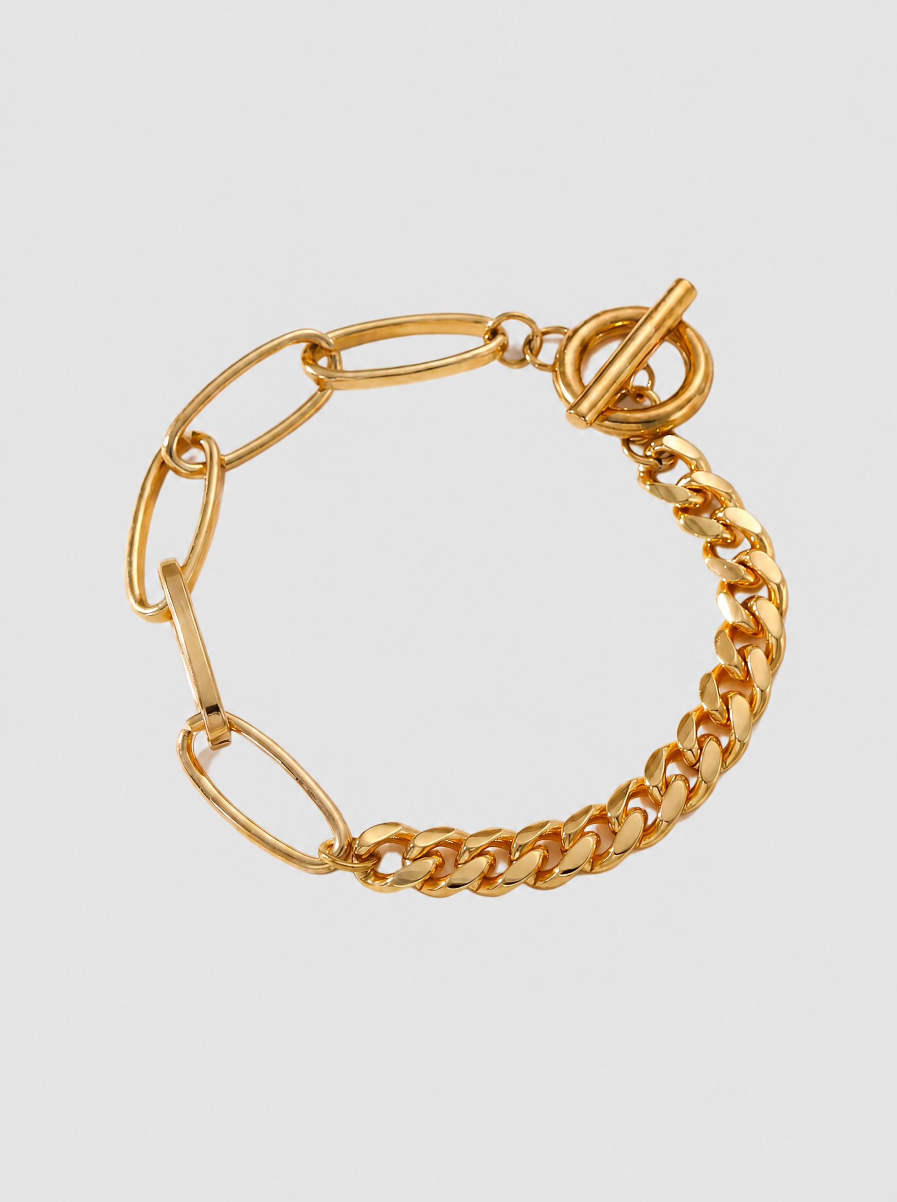 Lien paperclip link bracelet on soft grey background