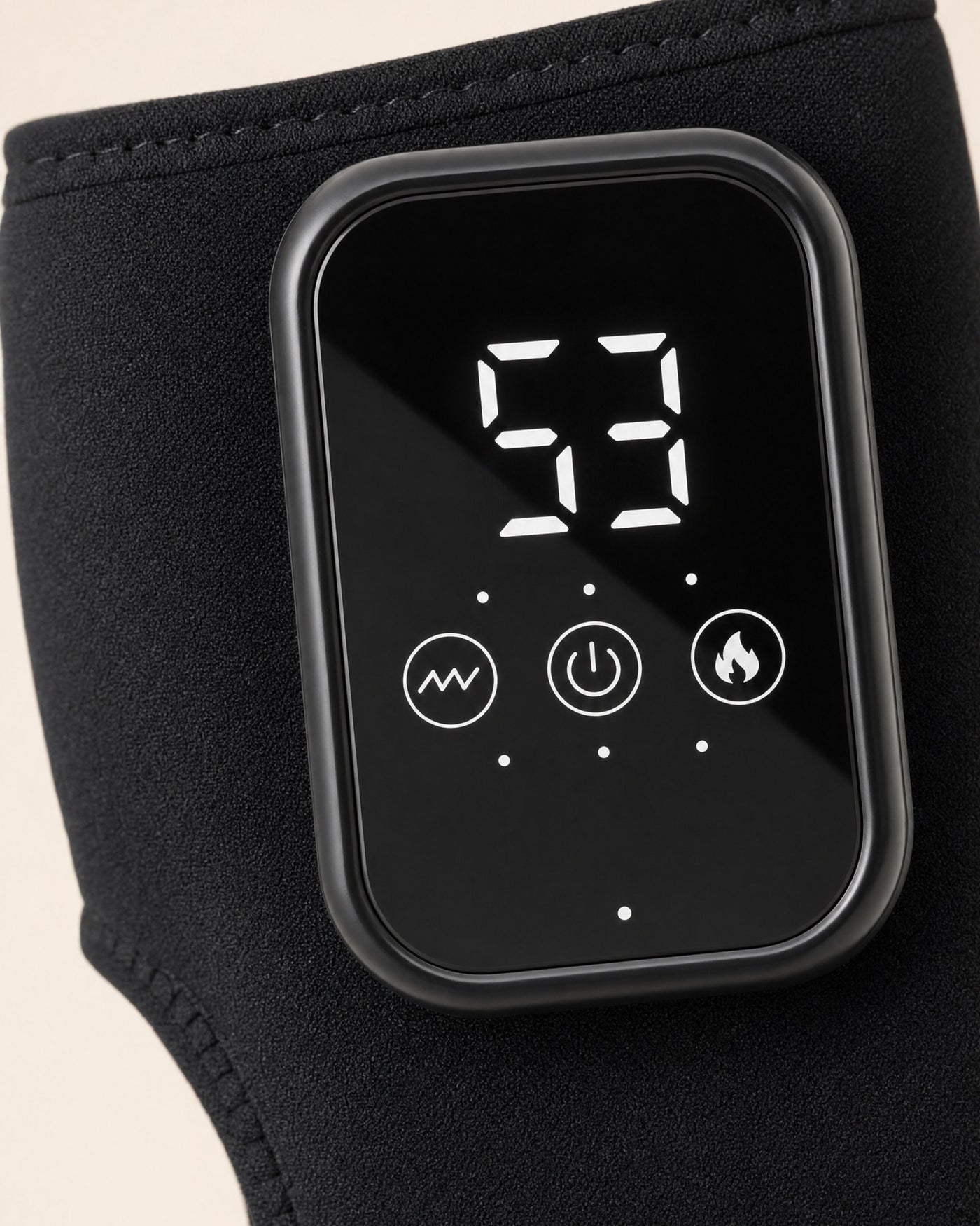 Control pod close-up: two-digit temperature readout above vibration, power and heat keys