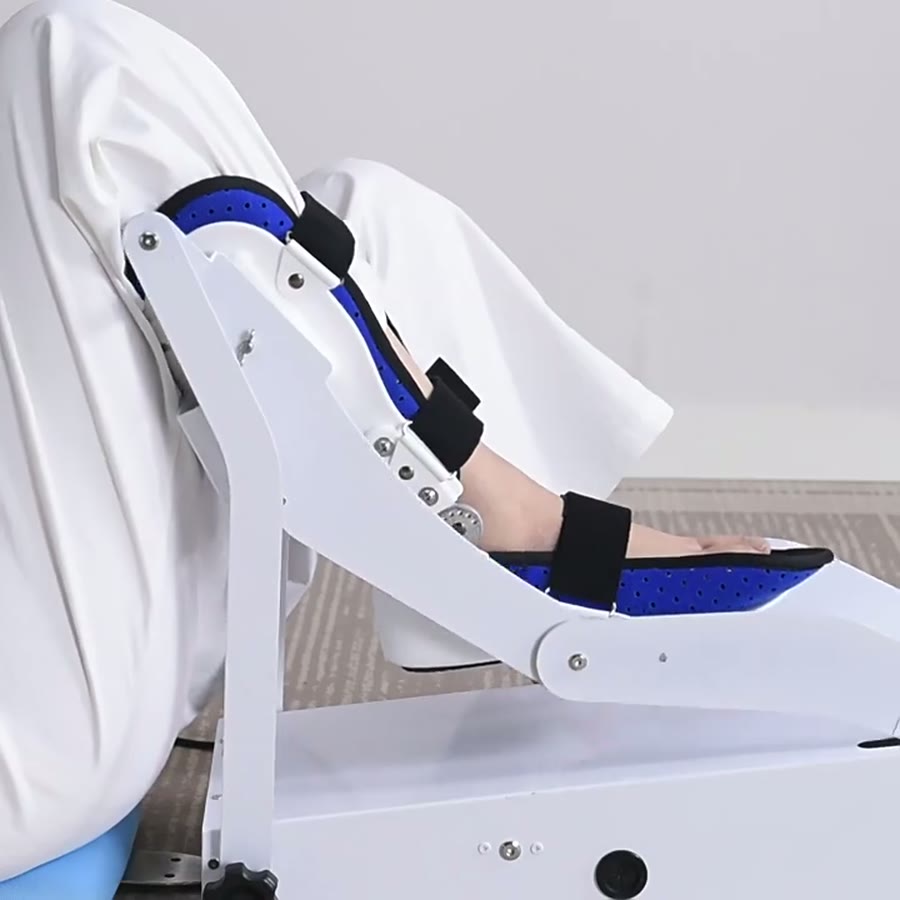 Black hook-and-loop straps fastened across the shin and foot