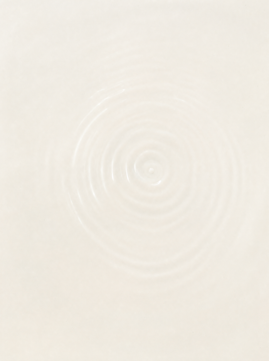 A single soft ripple on still water